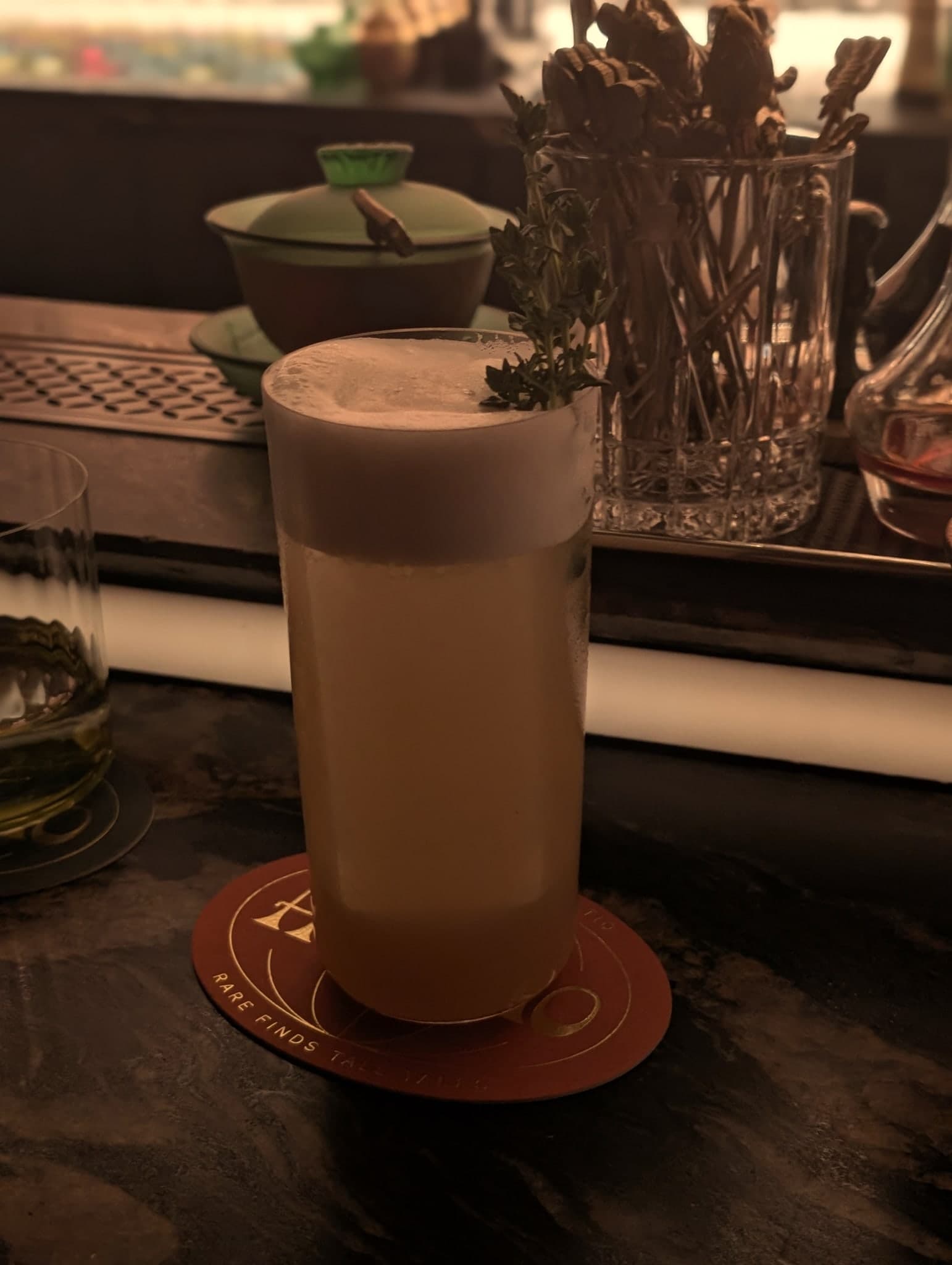 Falling Petals at Horatio — tall glass crowned with a cloud foam and a thyme sprig