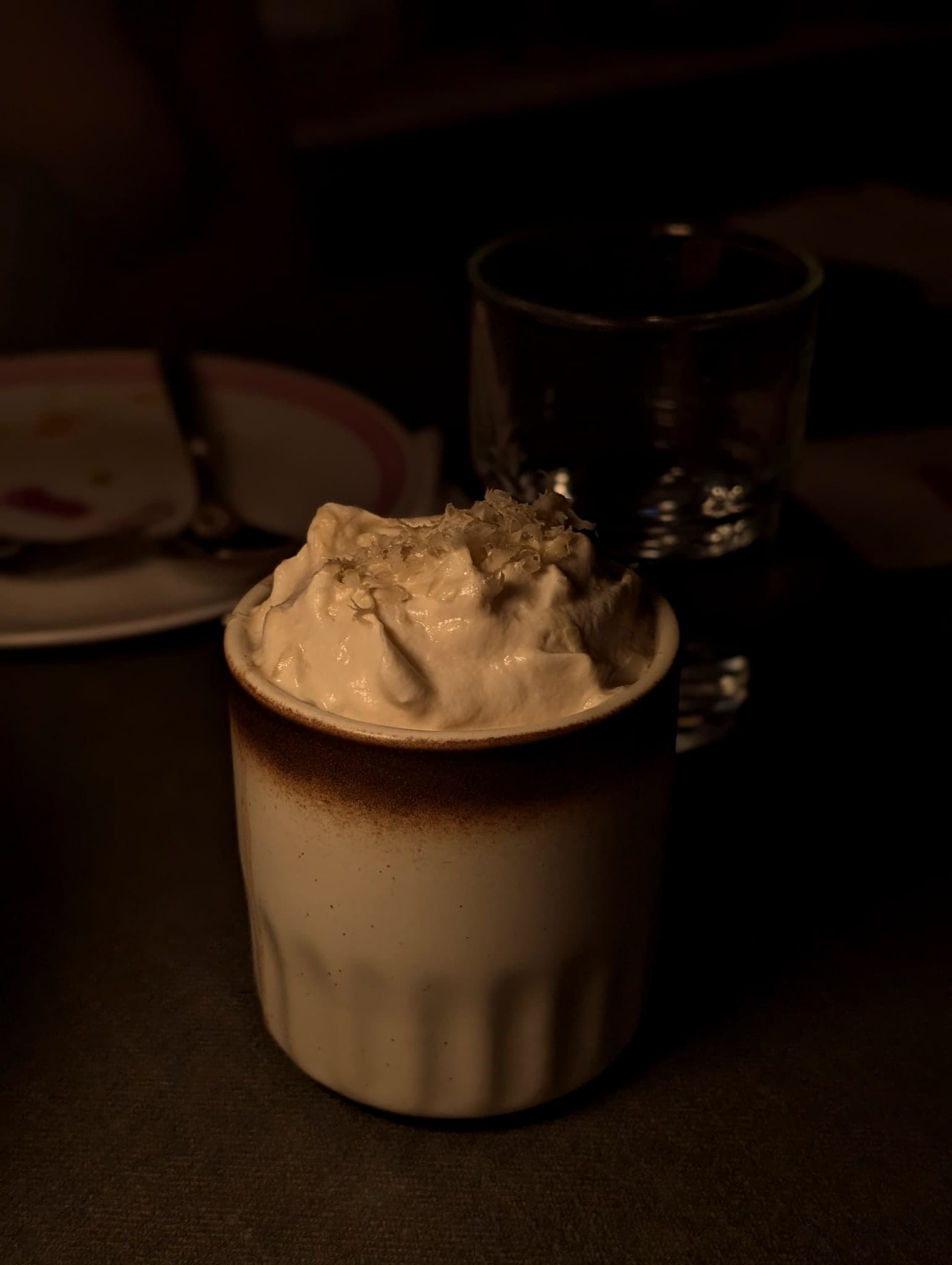 Stylo Milo at Nutmeg & Clove — fluted ceramic mug topped with a thick houjicha foam